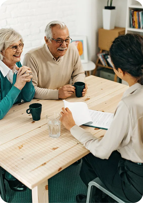 Attorney reviewing case files with client documents and medical records related to mesothelioma litigation