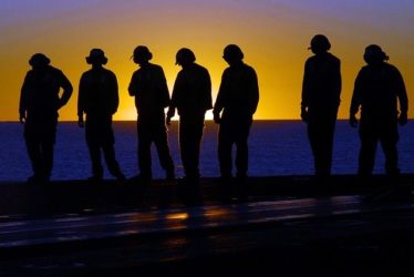 Image of military personnel aboard an aircraft carrier, representing the crews who may have been exposed to asbestos while serving or working on the various missions of the USS Hancock and how Nemeroff Law Firm can help determine whether those suffering from asbestos-related illnesses as a result of that exposure are entitled to compensation.