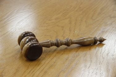 Image of a gavel on a table, representing the experienced attorneys at Nemeroff Law Firm. After you learn more about Nemeroff Law, contact us for a free consultation about your legal matter.