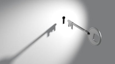 Image of a key and a keyhole, representing the money securely held in mesothelioma trust funds for victims of asbestos exposure.