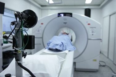 Photograph of a patient having a CT scan or MRI, representing a victim of a traumatic brain injury that requires repeated medical treatments. Reach out to an experienced traumatic brain injury attorney at Nemeroff Law Firm.