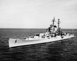 Image of the USS Albany (CA-123) underway, representing those who were exposed to asbestos on the USS Albany and how the mesothelioma lawyers at Nemeroff Law Firm are ready to defend the legal rights of those victims.